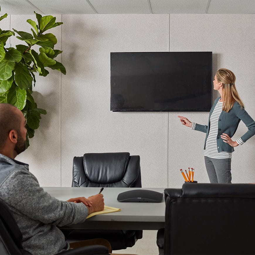 woman presenting in a conference room inside of a mobile office
